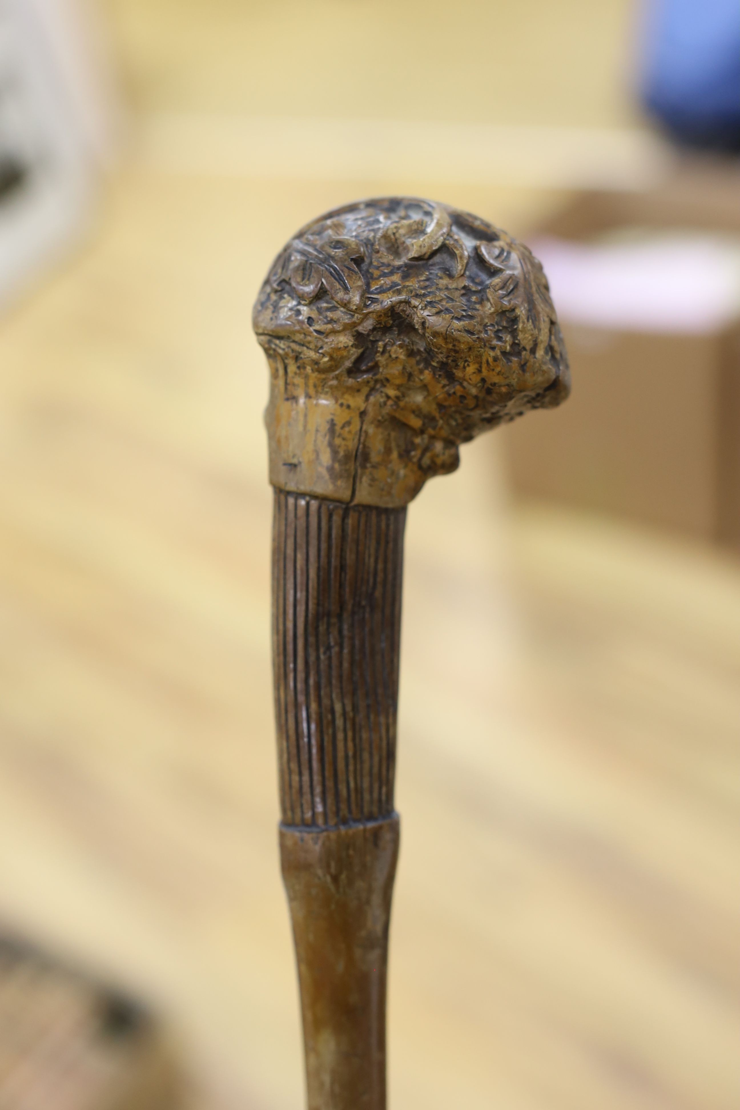 A 19th century folk art walking stick, 89 cms long.